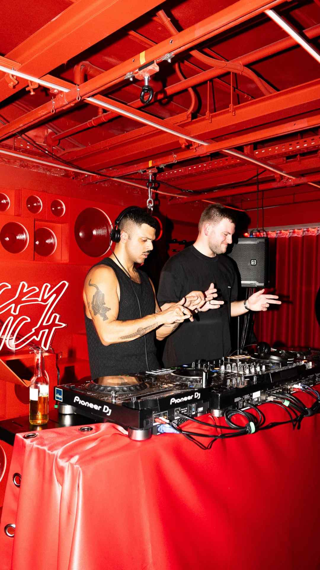 Two DJs performing at an afterparty