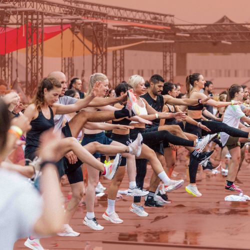 A group workout class jumping in unison